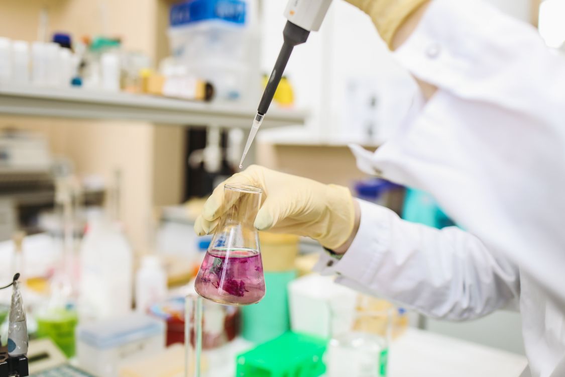 Scientist working with a pipette in a laboratory