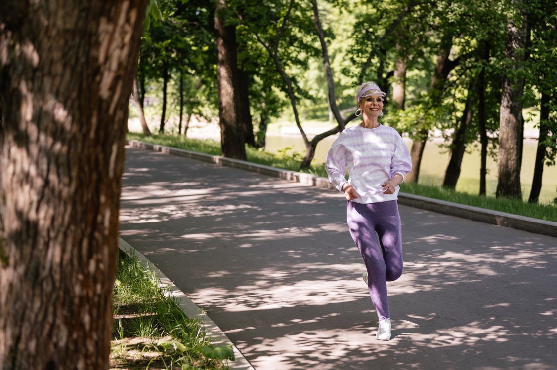 Active older woman enjoying a jog in a park